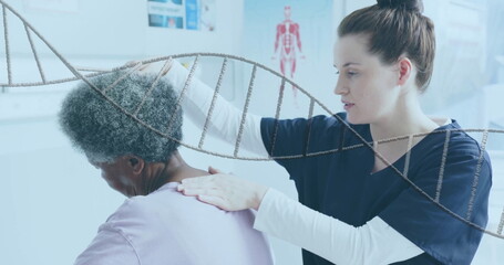 Image of dna strand over diverse female physiotherapist and senior female patient