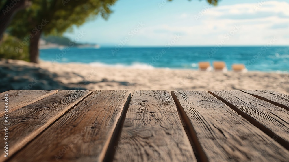 Poster blurred summer beach scene behind a wooden table ideal for placing summer advertising products and c