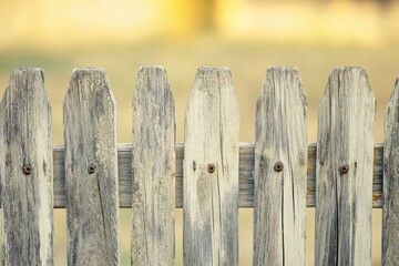 Weathered Wooden Fence With a Blurred Background