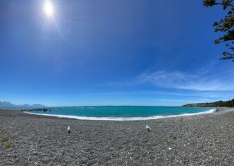Panoramic view of Kaikoura coastal beach on the sunny day and blue sky. Beach in summer
