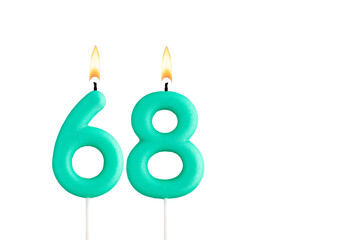 Green birthday candle on white background - Candle number 68