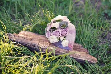 Unique bridal bouquet decor with roses and succulents on natural background. Selective soft focus