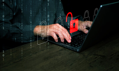 Cybersecurity and safety concept. A padlock is unlocked or hacked on laptop computer keyboard.  Cyber attack,  unsecured network, and internet security 