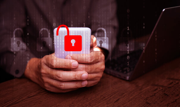 Cybersecurity and safety concept. A padlock is unlocked or hacked while using a smartphone. Cyber attack, unsecured network, and internet security