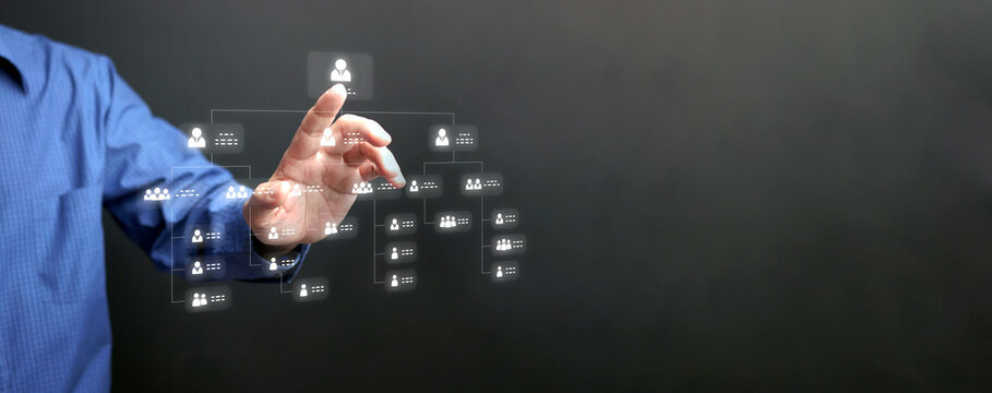 A man tapping on organization chart on virtual interface screen. Business process and workflow automation with flowchart. Hierarchical structure of teams and employees in the company