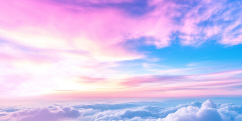 Obraz premium Tranquil sky with a gradient of pink and blue hues above soft, fluffy clouds, peaceful and dreamy atmosphere