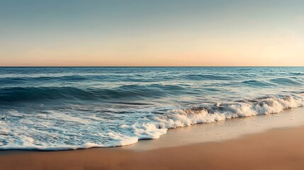 A Beautiful Coastal Scene at Dusk: Gentle Waves Crashing on the Sandy Shore Beneath a Soft Sky