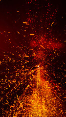 bright sparkling sparks and smoke from the fire

