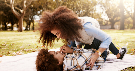Tickle, playing and mom in park with child for bonding, outdoor fun and laughing on blanket....