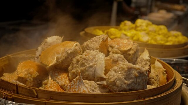 Deep-fried crab meat and minced pork in crab shell (Pu Ja). Chinese Traditional cuisine concept. Dumplings Dim Sum in bamboo steamer. Asian food background.
