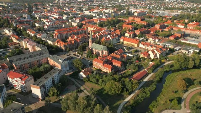 Drone shot of Elk Green City St. Wojciech Cathedral church and Gothic buildings in sunny afternoon
