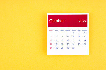 Calendar page October 2024 on yellow background.