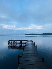 Obraz premium A jetty at the lake, pier on the lake with beautiful landscapes 