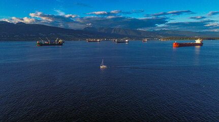 vibrant-vancouver-skyline-sunset-sailboat-cargo-ships-mountains-ocean.JPG
