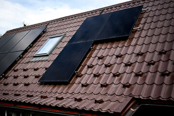 Photovoltaic solar panels installed on a roof producing clean energy for a sustainable future