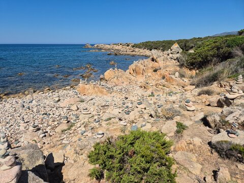 Stacking stones (cairns) at Sentier Littoral des Bruzzi, crosica, france