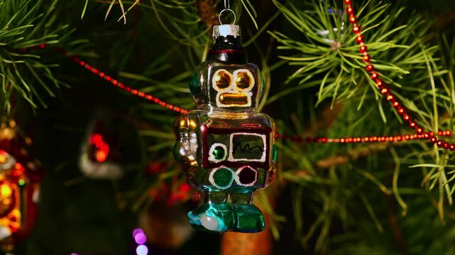Robot. Christmas tree, toy decorations. New Year and Merry Christmas. Smooth camera movement on the slider. Video postcard. Live christmas tree with garlands and toys