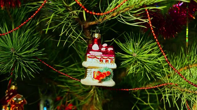 House, home, new realty, realtor greetings. Christmas tree, toy decorations. New Year and Merry Christmas. Smooth camera movement on slider. Video postcard. Live christmas tree with garlands and toys