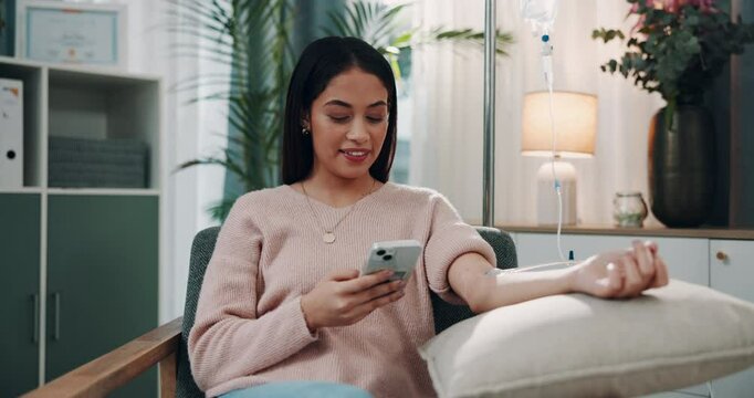 Phone, vitamins and woman on iv drip in clinic for healthcare treatment, medication or healing. Medical checkup, infusion and patient in hospital office for wellness, nutrition or natural medicine.