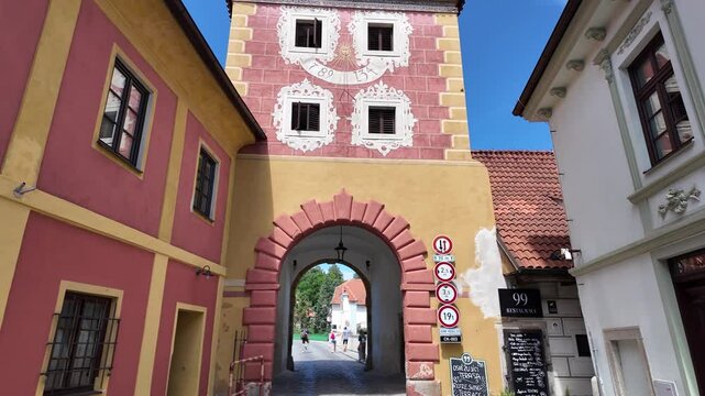 Budweiser Gate in Česk&yacute; Krumlov captured on a sunny day, historic colorful architecture