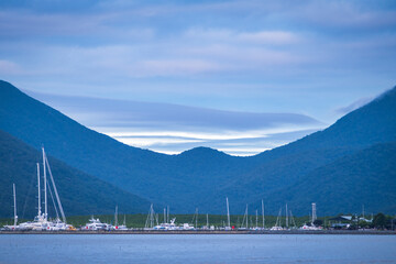 Boats moored at the Cairns marina at dusk, north Queensland, Australia