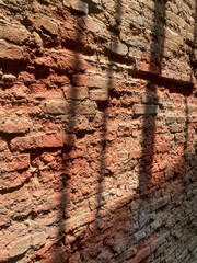 Aged Red Brick Wall with Rough Surface