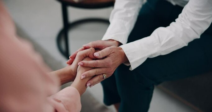 Holding hands, support and women with care in therapy for bad news, depression and mental health. Comfort, closeup and person with kindness, empathy and help for rehabilitation at psychology clinic