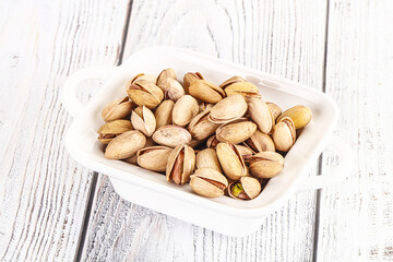 Salted tasty pistachio nuts heap