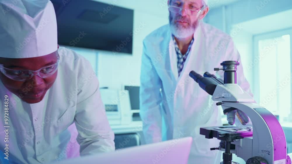 Wall mural researchers analyzing samples in a modern laboratory setting