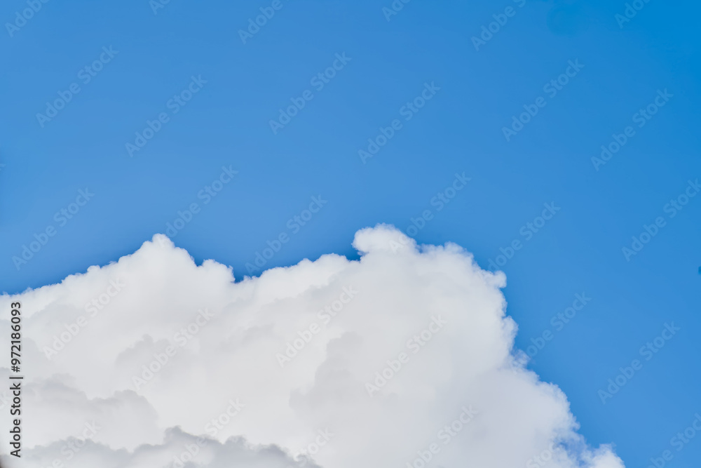 Wall mural majestic white clouds against blue sky