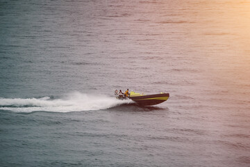 Patrol boat slicing through rough ocean waves