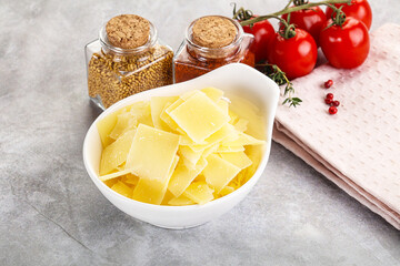 Sliced parmesan cheese in the bowl