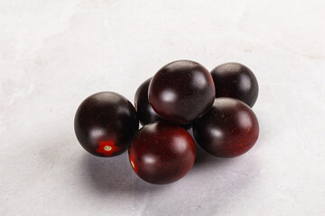 Raw ripe black kumato tomato