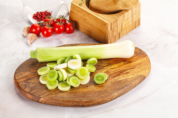 Ripe sliced leek over board