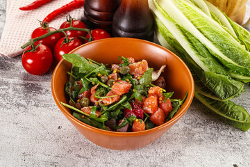 Salad with salmon and arugula