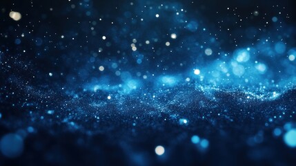 Obraz premium A mesmerizing abstract background featuring shimmering blue particles and light effects.