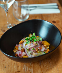 Gourmet plate of sea bass and red onion ceviche
