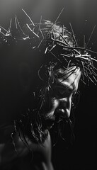 Dynamic black and white image of jesus with crown of thorns illuminated by dramatic lighting effects