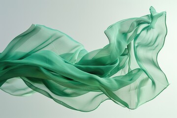 A close-up shot of a green cloth being lifted and blown away by the wind