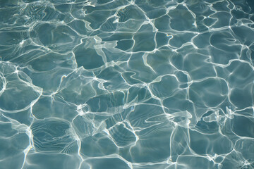 Ripple water surface and sun reflection for background. swimming pool.