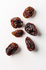 Freshly harvested dates arranged on a clean white surface
