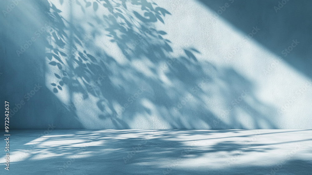 Poster subtle interplay of shadows and light on a textured blue wall creating a tranquil atmosphere
