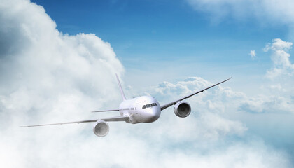 Passengers commercial airplane flying above clouds in sunset light. Concept of fast travel, holidays and business.