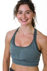 Fototapeta premium A woman poses for a photo wearing a sports bra, suitable for fitness or lifestyle images