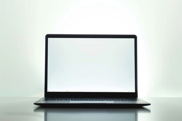 Fototapeta premium A person's laptop is placed on a table with a simple background