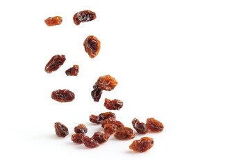 Fototapeta premium A close-up shot of a pile of raisins on a white surface, perfect for food and dessert images