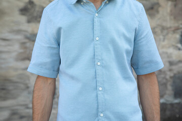 Man wearing summer shirt with short sleeves.