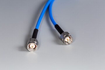 Silvery coaxial threaded connectors on the high-frequency cable edges