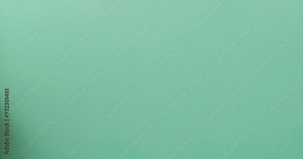 Poster a close-up view of a soft mint green background suitable for various creative projects and designs. 