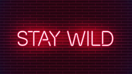 Obraz premium Neon sign stay wild on red brick wall